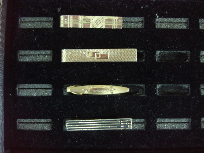 Set of four vintage gold-tone tie clips
