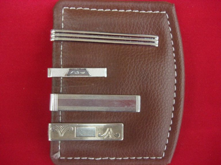 Vintage silver-tone tie clips (lot of 4) with unique designs