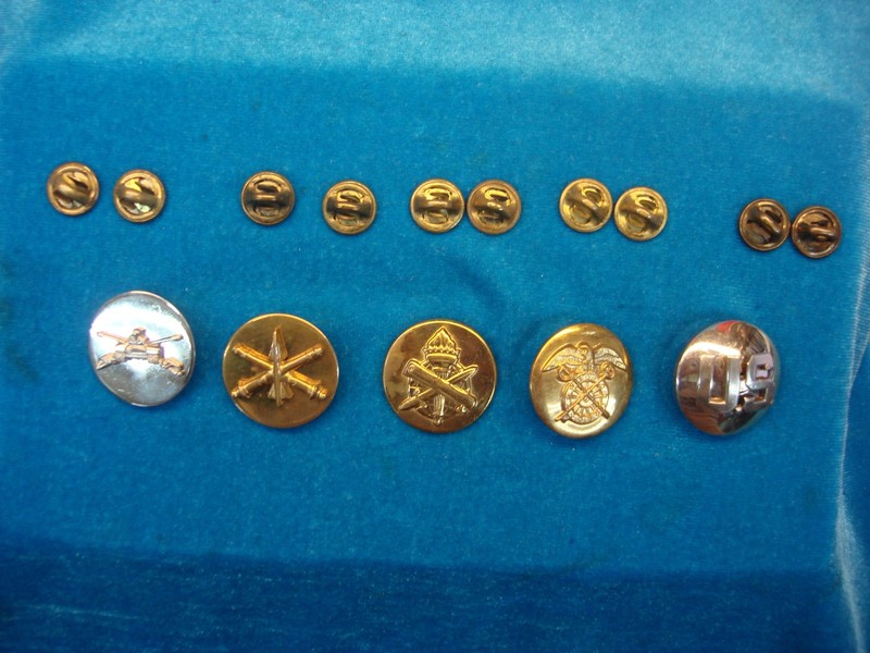 Set of five unique US Army collar pins featuring Armor, Quartermaster, Air Defense, Civil Affairs, and U.S. insignia.
