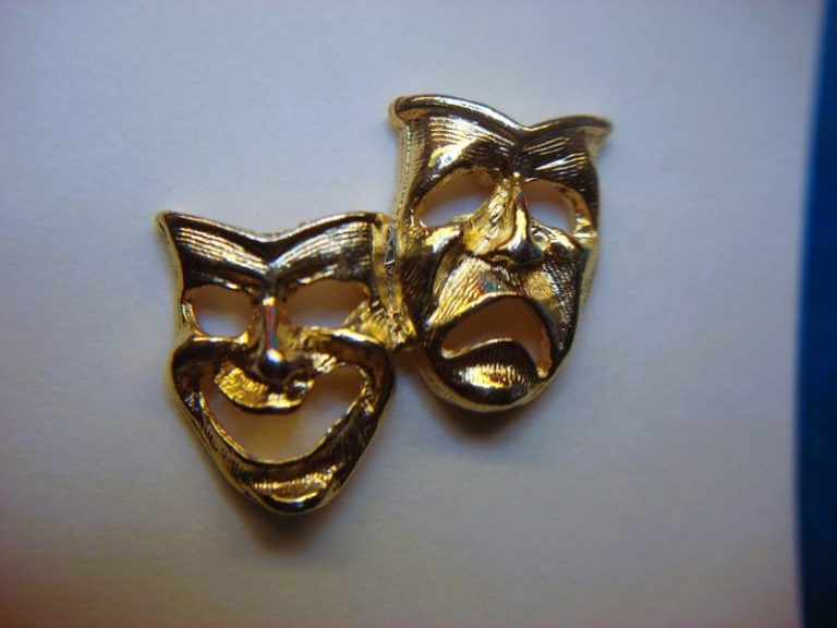 Vintage gold-tone Thespian Masks collar pin with intricate theatre design