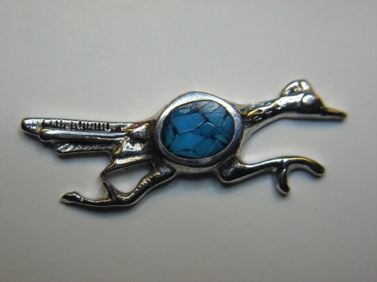 Vintage silver-tone Roadrunner lapel pin with amethyst chips