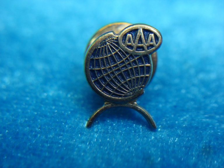 Vintage gold-tone lapel pin with blue enamel
