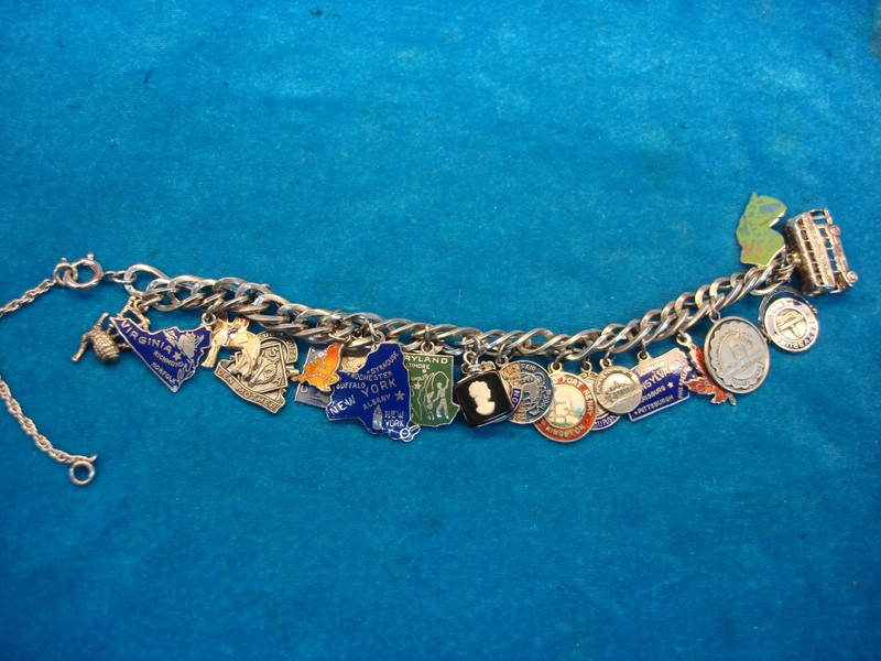 Vintage Sterling Silver Charm Bracelet with over 20 charms featuring USA, UK, Canada & Germany designs