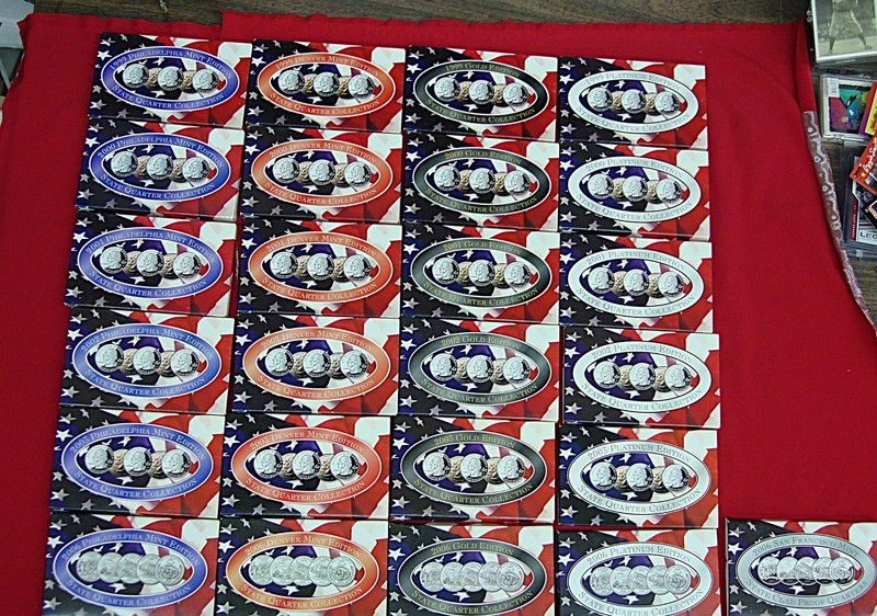 Collection of US State Quarter Sets (1999-2006) from Philadelphia and Denver Mints, including layered gold and platinum sets.