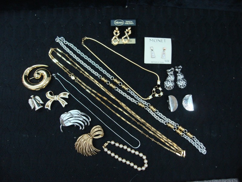 Vintage Monet jewelry lot including pins, necklaces, earrings and a bracelet