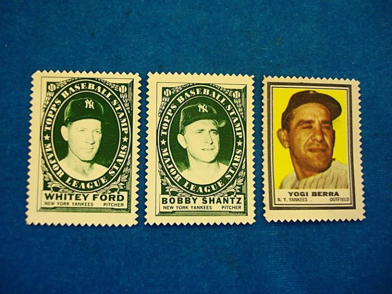 Vintage Topps baseball cards from the 1960s featuring Yogi Berra, Whitey Ford, and Bobby Shantz.