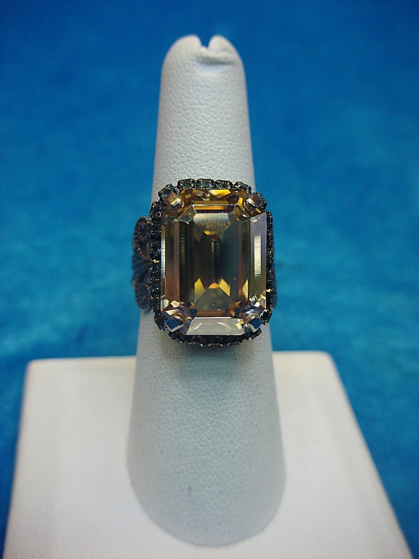 Sorrelli adjustable ring with a champagne-colored emerald cut stone, size 7