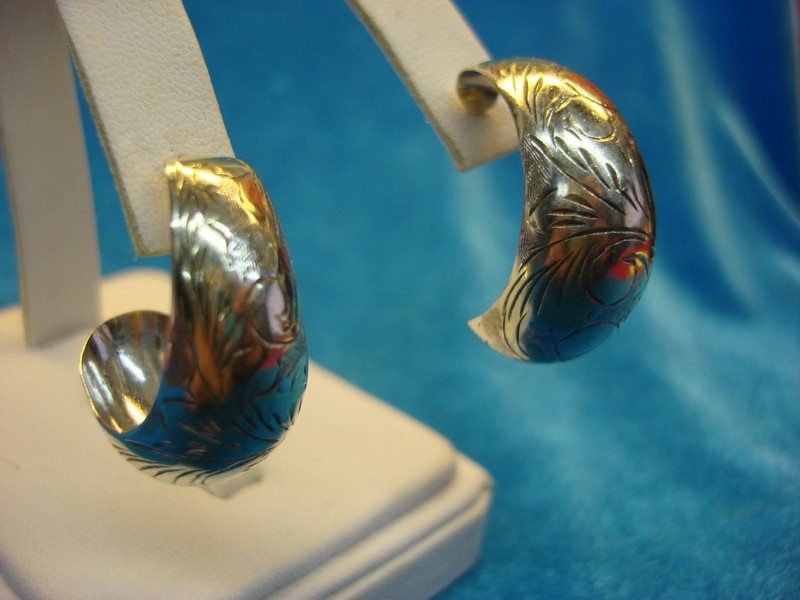 Sterling silver half hoop earrings with a unique pattern