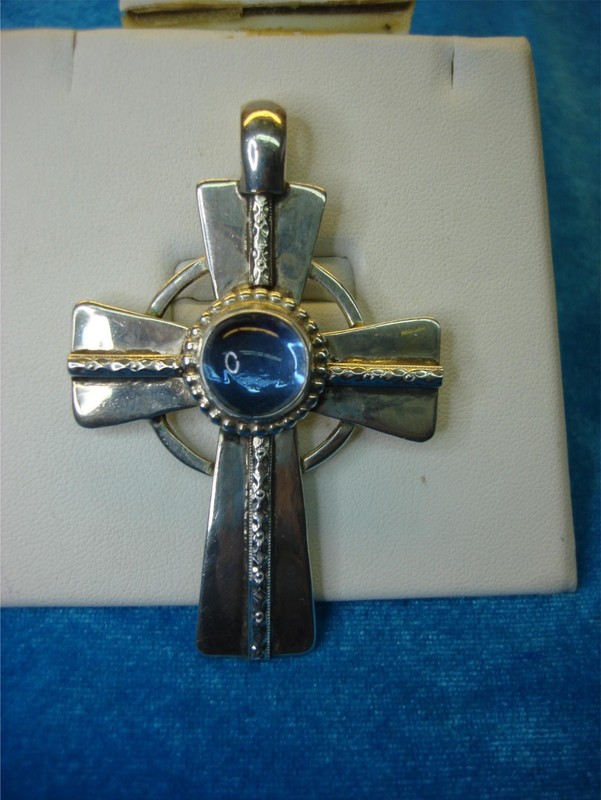 Large sterling silver Celtic cross pendant with a blue stone