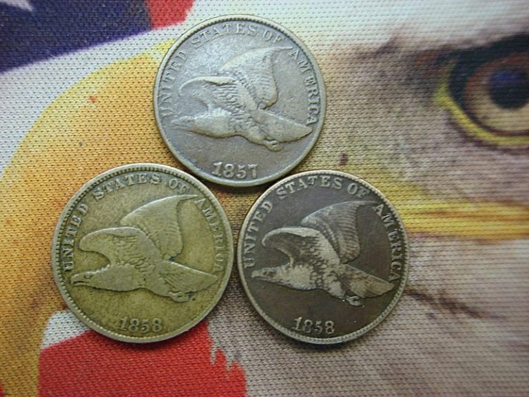 Three circulated US Flying Eagle cents from 1857, 1858 (Small Letters), and 1858 (Large Letters)