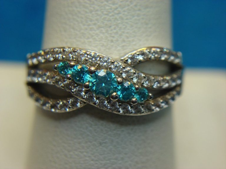 Sterling silver ring with blue gemstones and cubic zirconia stones, size 10