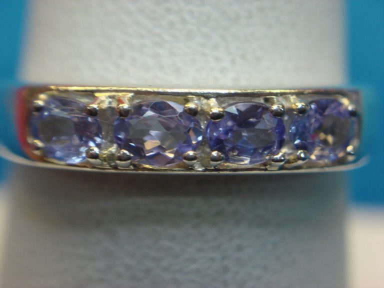 Elegant sterling silver ring with purple stones, size 8