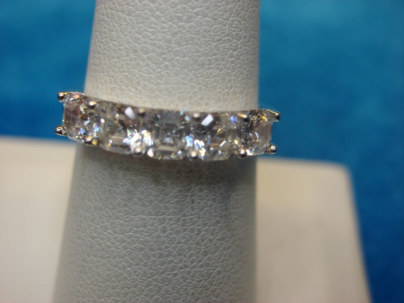 Sparkling sterling silver ring with five square cubic zirconia stones, size 8