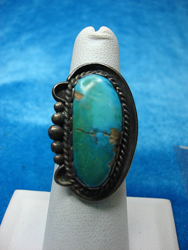 Vintage Native American silver ring with large turquoise stone, marked 'IZ', size 6 1/4