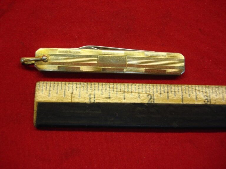 Vintage U.S.A. vest pocket knife with two blades and gold-tone panels