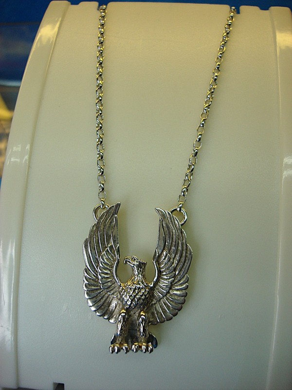Sterling silver heraldic eagle pendant and chain signed 'JF', Native American inspired