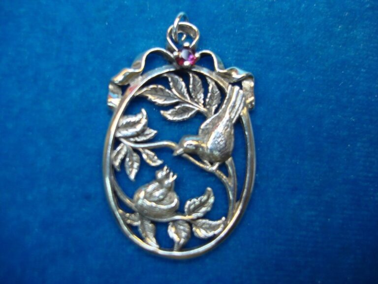 Vintage Franklin Mint sterling silver bird and young pendant with red topaz, 1984