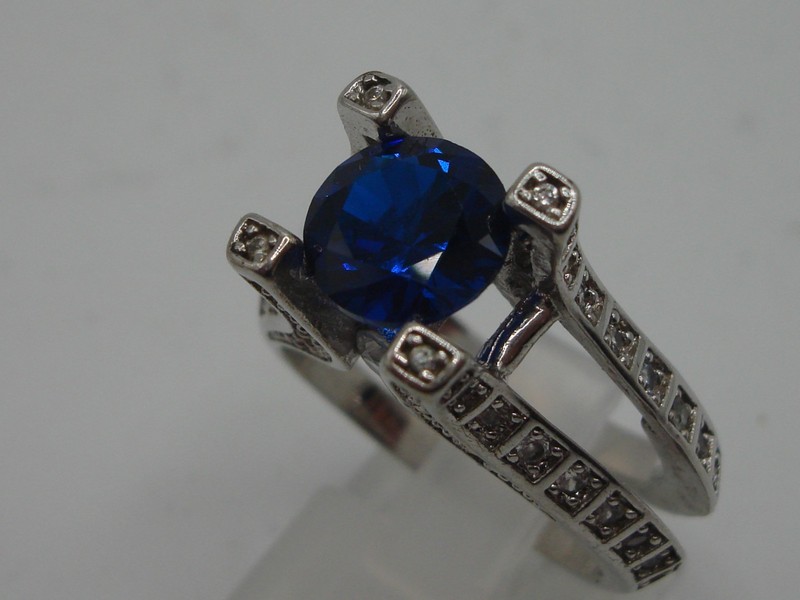 Eye-Catching Silver Tone Ring with Floating Blue Stone & CZ Accents