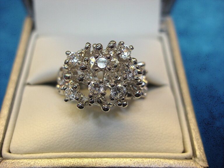 Sparkling white gold electroplate cocktail ring with cubic zirconia stones, size 8.75