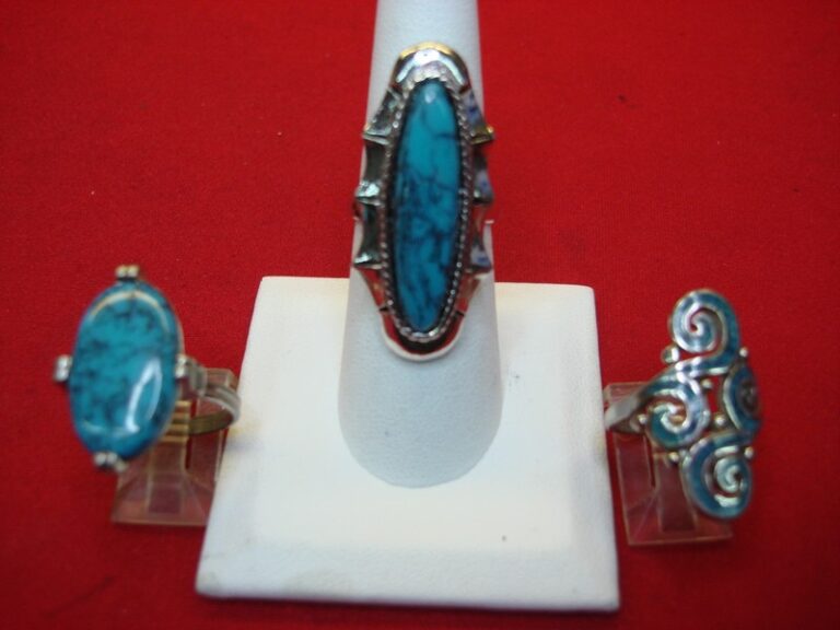 Three silver-tone rings with faux turquoise stones, sizes 6 and adjustable 7