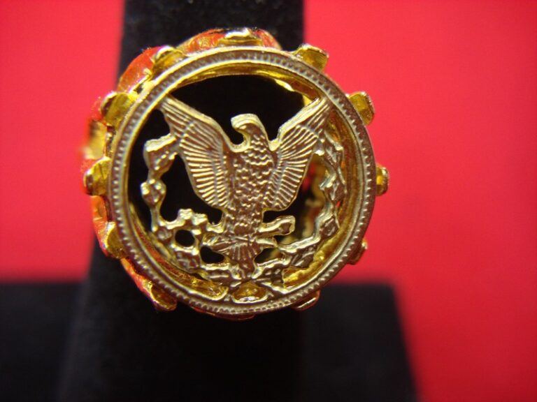 Gold-tone ring with a heraldic eagle design, vintage inspired, adjustable, like old silver dollars