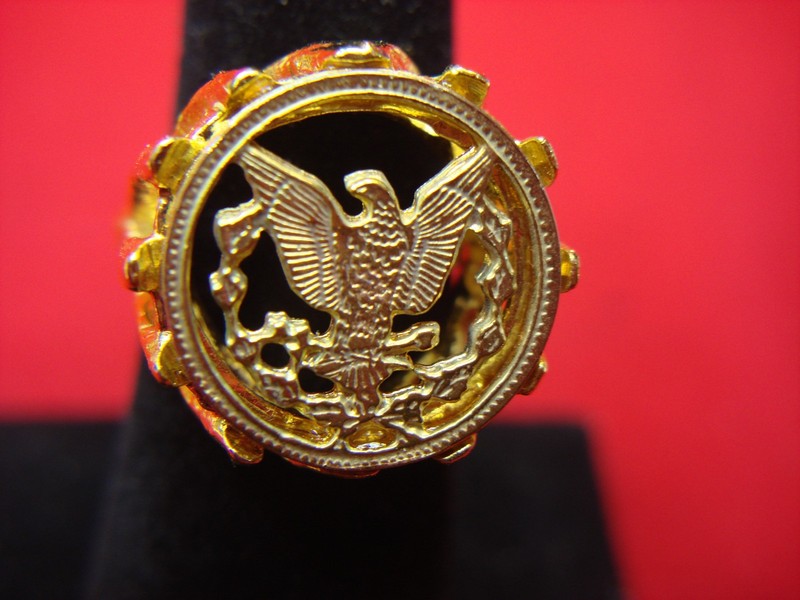 Gold-tone ring with a heraldic eagle design, vintage inspired, adjustable, like old silver dollars