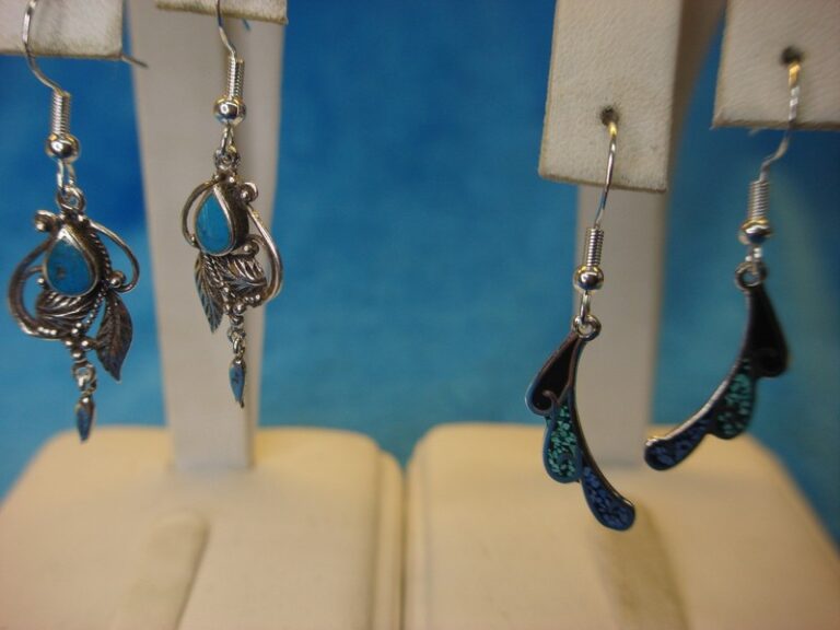 Sterling silver dangle earrings with turquoise insets