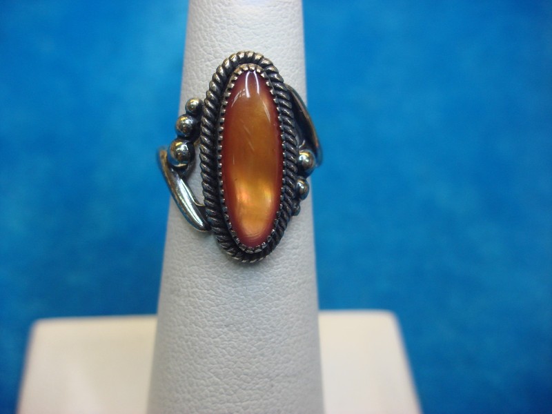 Sterling silver ring with amber oblong stone, fancy setting (size 5)