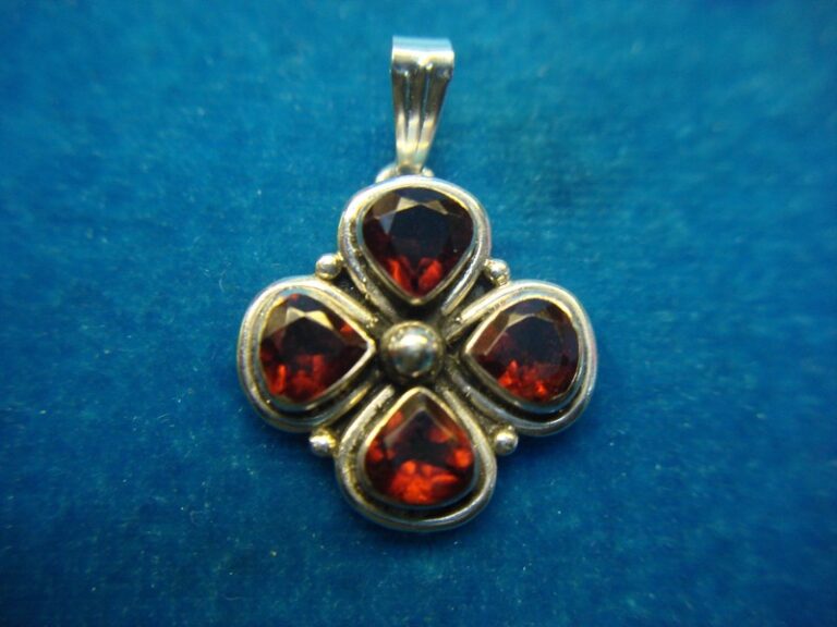 Vintage sterling silver clover leaf pendant with red stones