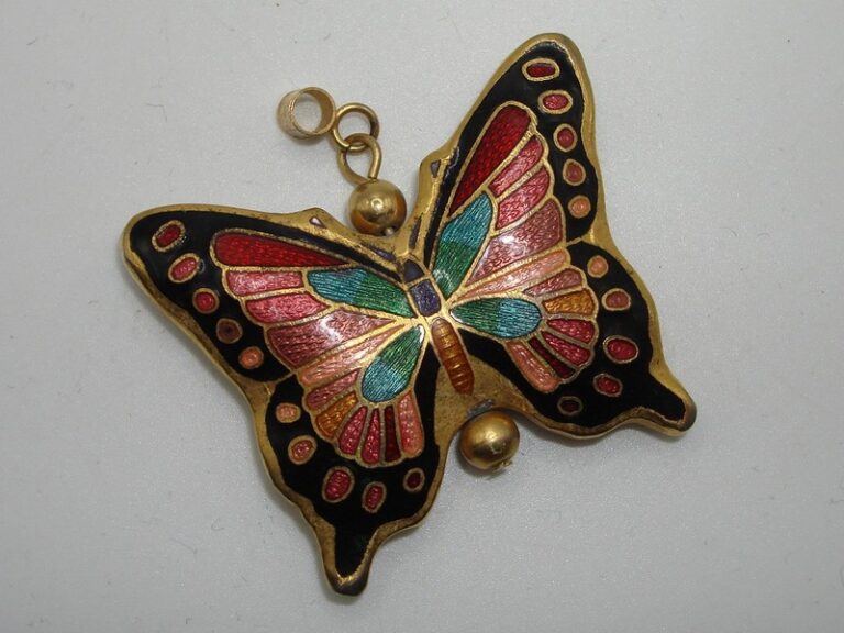Vintage cloisonne enamel butterfly pendant in gold tone with intricate design.
