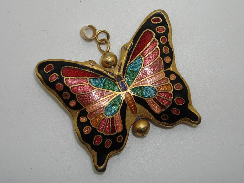 Vintage cloisonne enamel butterfly pendant in gold tone with intricate design.