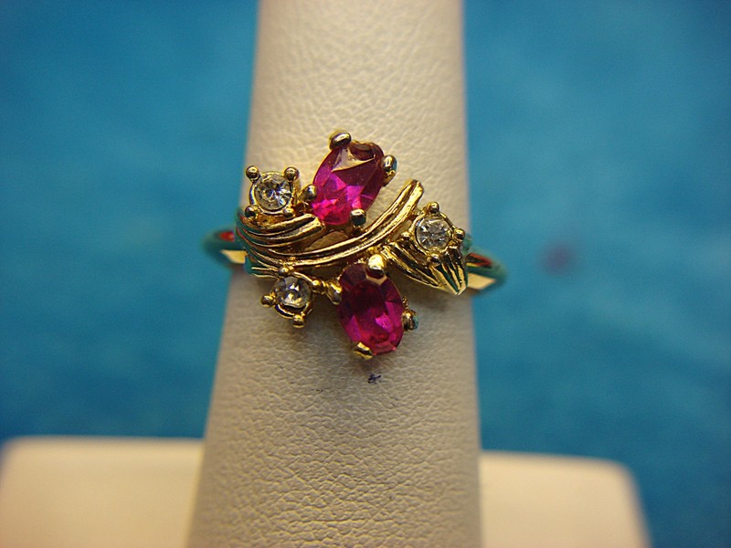 Avon gold-tone ring with red stones and brilliant accents