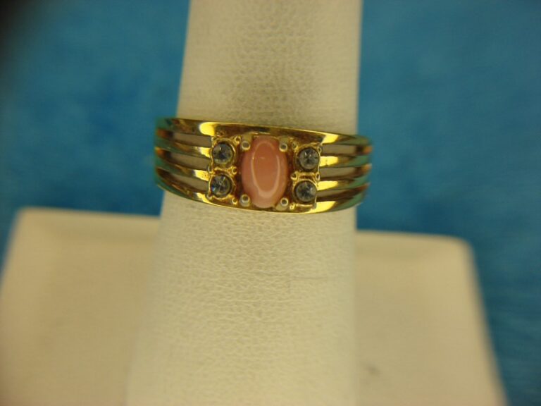 Avon gold tone ring with pink stone and diamonds, size 7 1/2