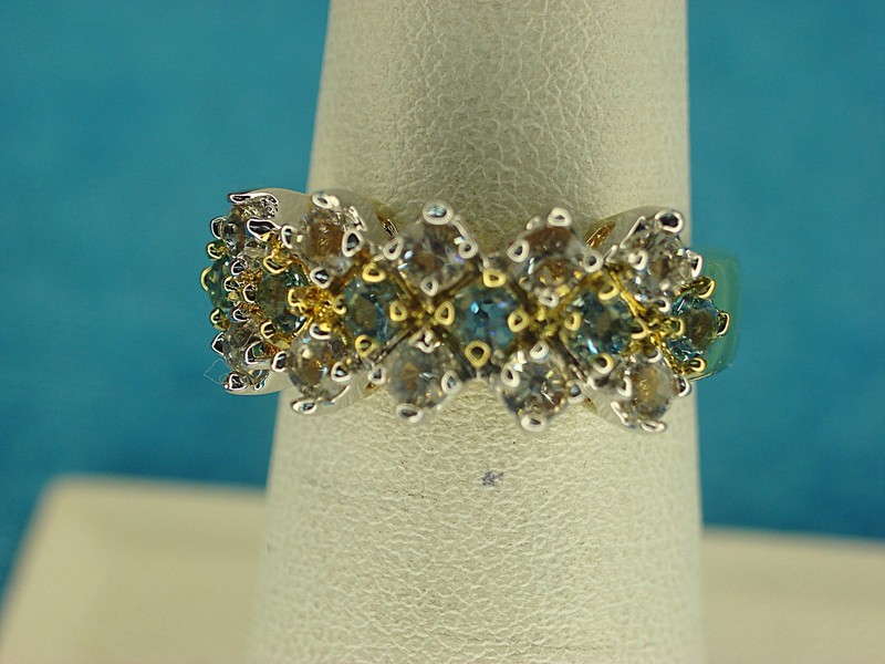 Gold-tone fashion ring with blue and clear stones, size 6 3/4