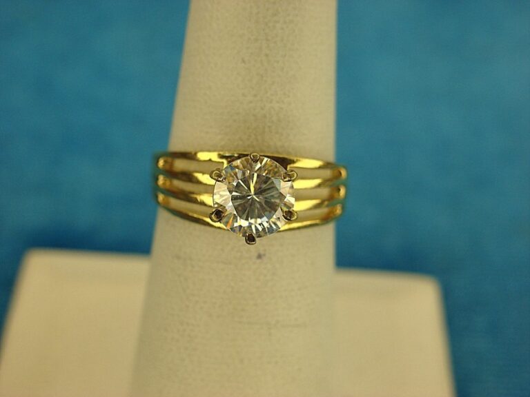 Gold tone ring with a 7mm faux diamond, size 6 3/4