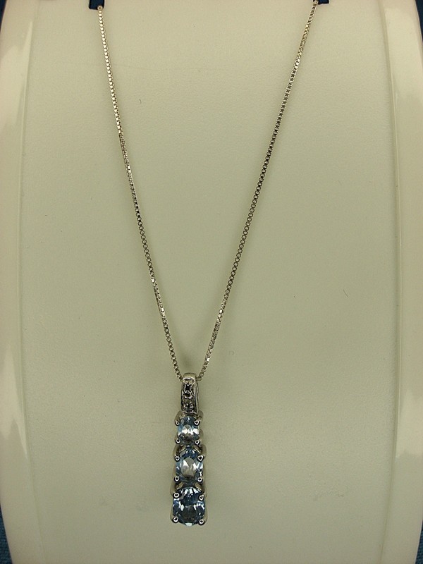 Sterling silver blue topaz pendant necklace with graduated gemstones