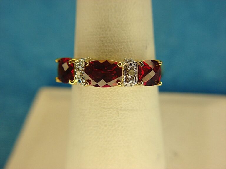 Sterling silver ring with gold vermeil, red stones, and accent diamonds. Size 8.