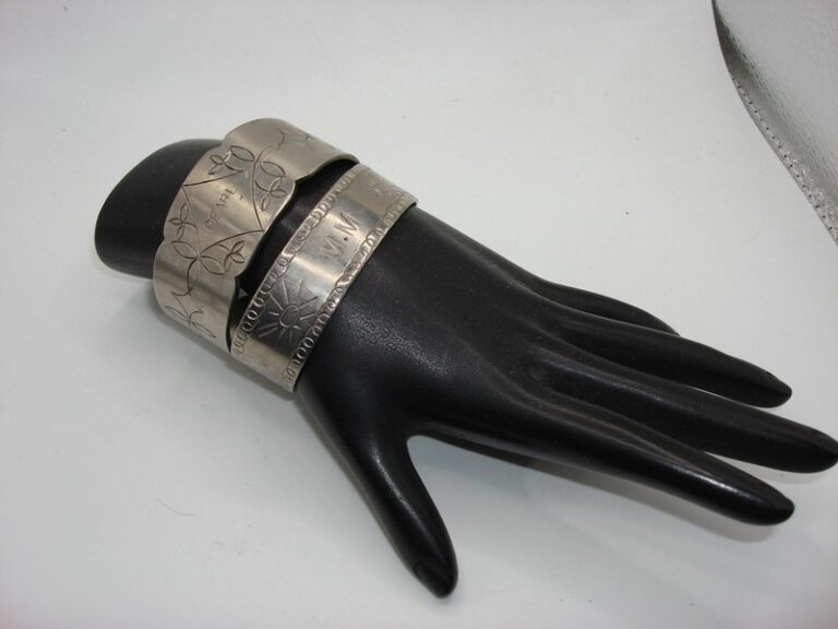 Vintage aluminum cuff bracelets from the 1930s-40s, engraved with 'PEARL' and 'M-M'