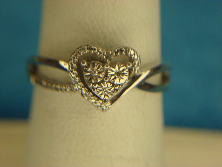 Sterling silver heart ring with diamond accents, size 7