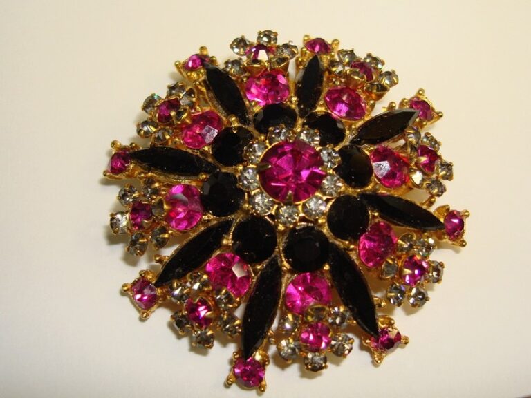 Vintage rhinestone brooch with pink, black, and clear foiled stones