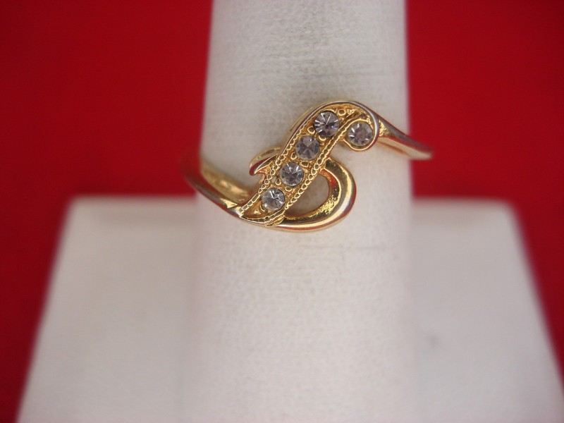 Avon gold-tone ring with clear stones, size 8