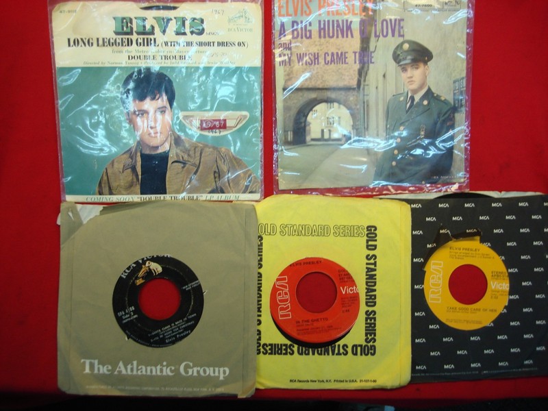 Vintage Elvis Presley 45s - a collection of five classic hits on vinyl records.
