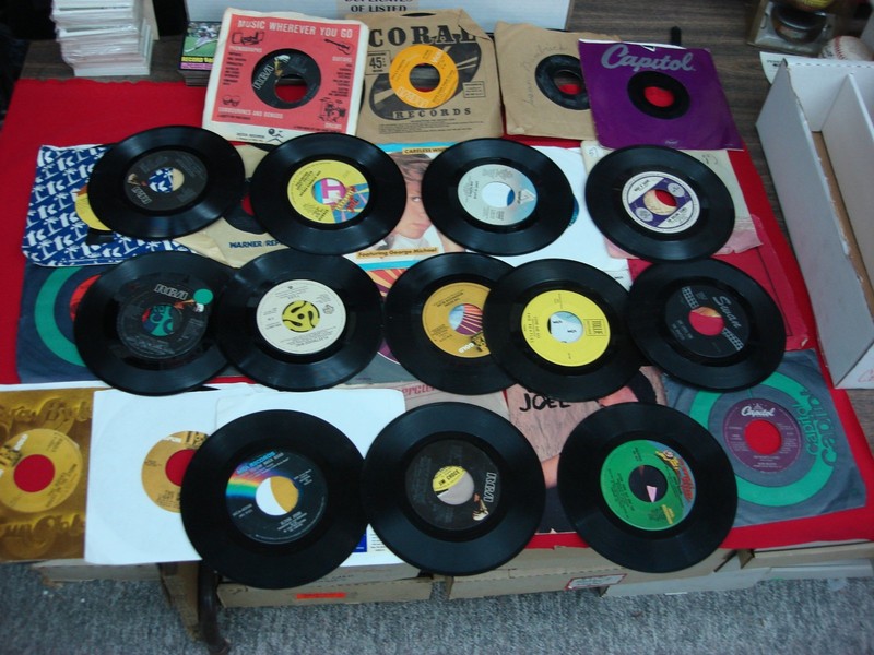 Collection of over 30 vintage 45 RPM records from the 1970s and 1980s
