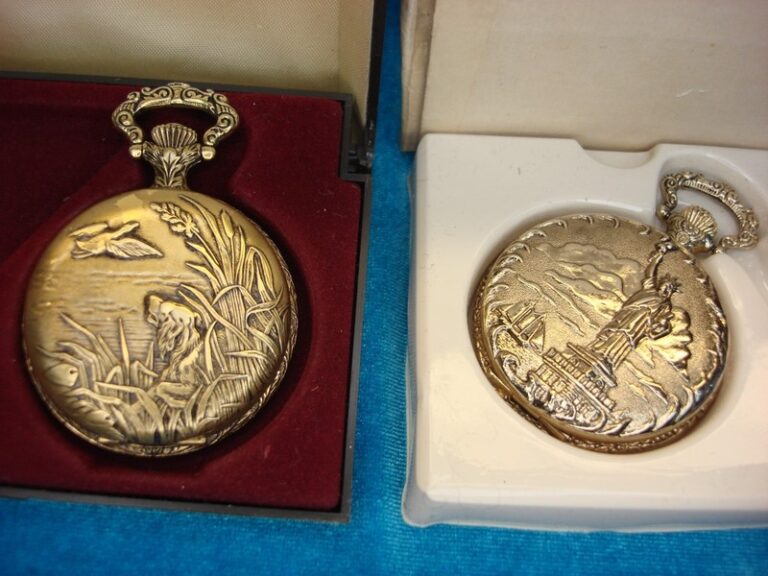 Pair of vintage-style pocket watches with duck hunting and Statue of Liberty designs