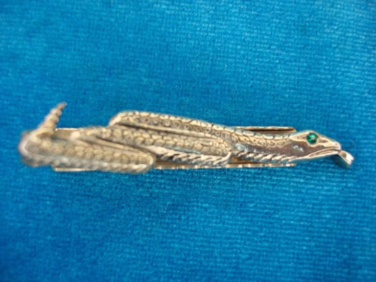 Vintage gold-tone serpent tie clip with green eyes