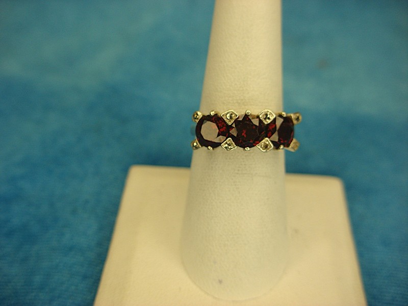 Vintage sterling silver ring with three red stones, size 7.5