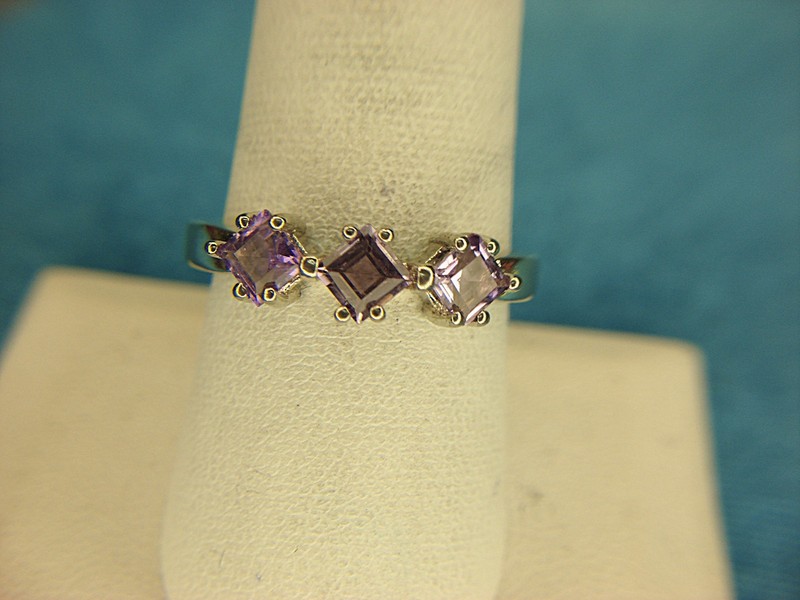 Vintage sterling silver ring with three purple princess cut stones
