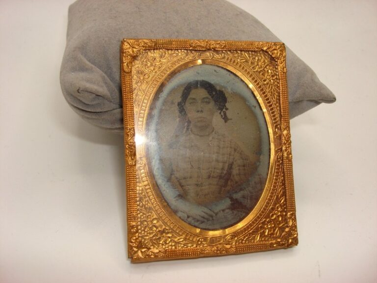 Antique 1800s daguerreotype in ornate brass frame