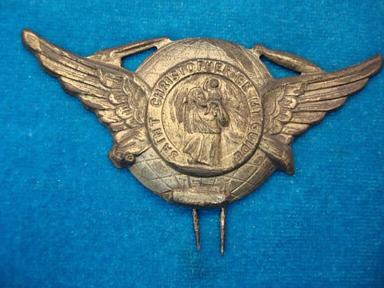 Vintage WWII St. Christopher Badge with car, train, blimp, ship, and plane icons.