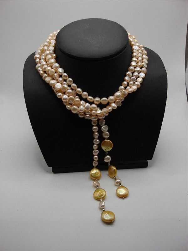 Creamy ivory freshwater pearl necklace with gold baroque accents